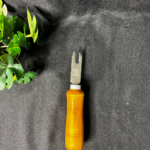 Wooden handle resin art tool with a metal fork tip used for detailed craft and resin work