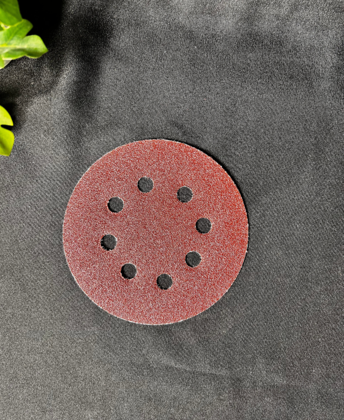 Fine-grit sandpaper sheet used for smoothing resin and wood surfaces