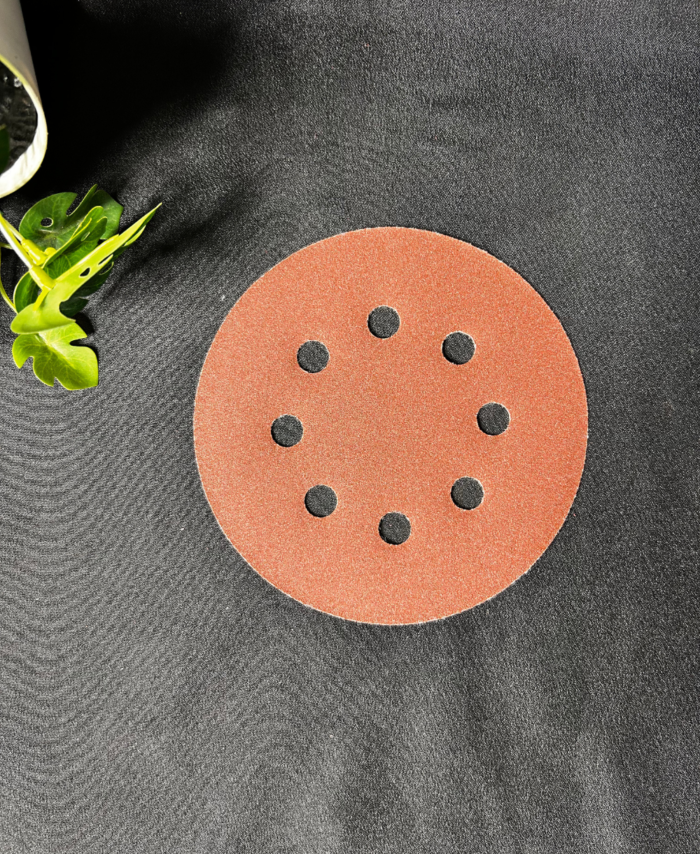 Fine-grit sandpaper sheet used for smoothing resin and wood surfaces