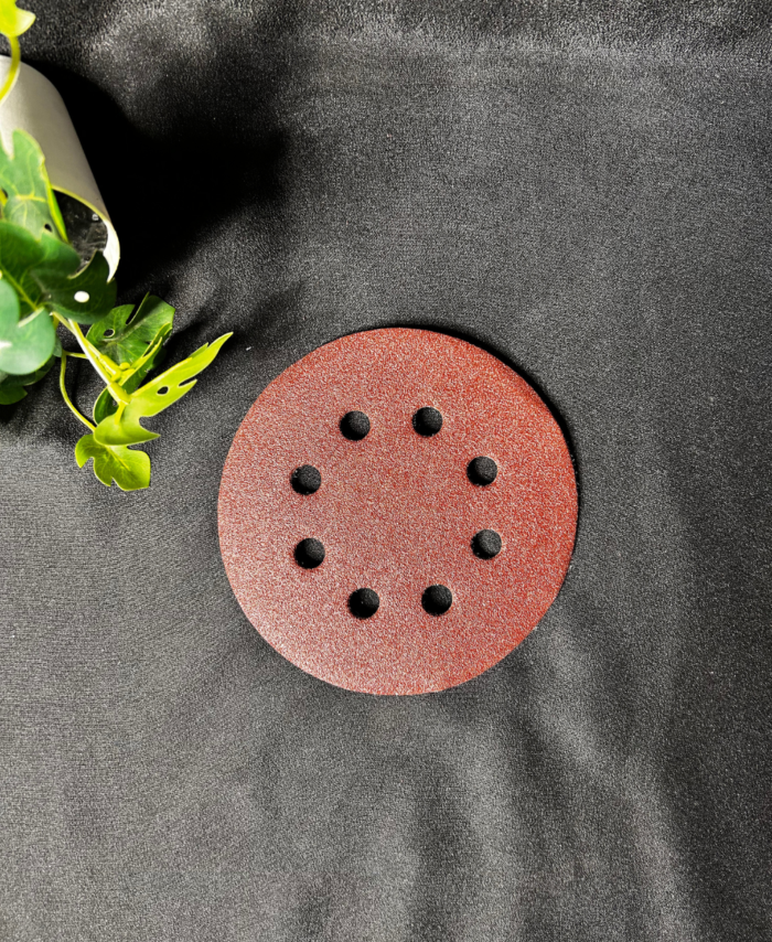 Fine-grit sandpaper sheet used for smoothing resin and wood surfaces