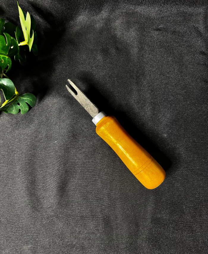 Wooden handle resin art tool with a metal fork tip used for detailed craft and resin work