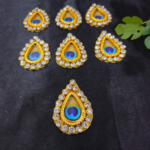 Teardrop-shaped Morepankha peacock feather decorative patch with stones