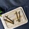 Wooden tray with metal handles and screws placed on a wooden base for DIY resin art and home décor projects