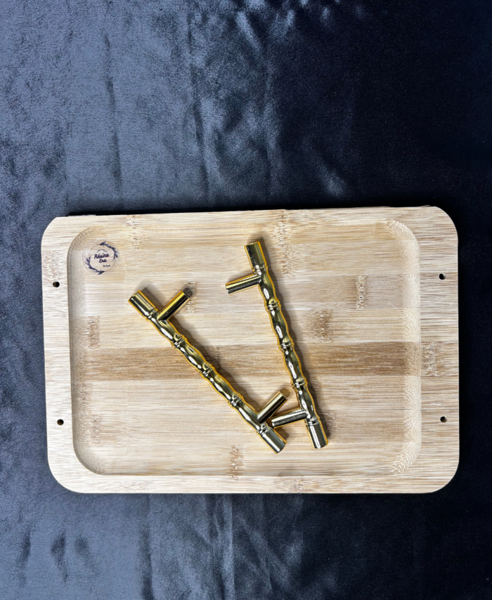 Wooden tray with metal handles and screws placed on a wooden base for DIY resin art and home décor projects