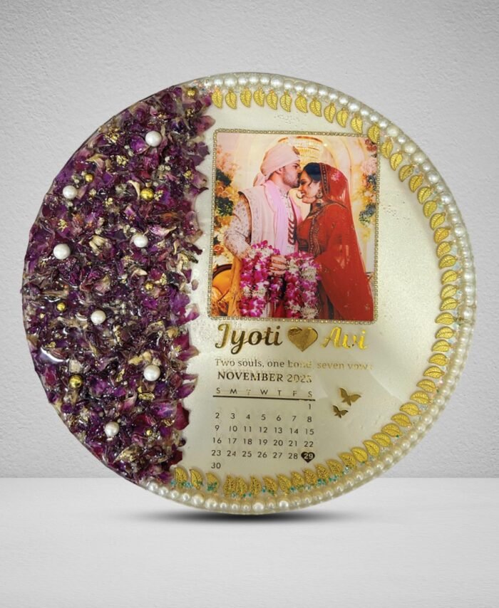 Round varmala resin frame with preserved wedding flowers, couple photo, calendar date, and pearl gold detailing