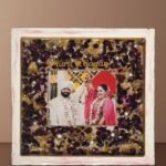 Wedding flower preservation resin frame with couple photo, preserved petals, pearl accents, and customized names and date