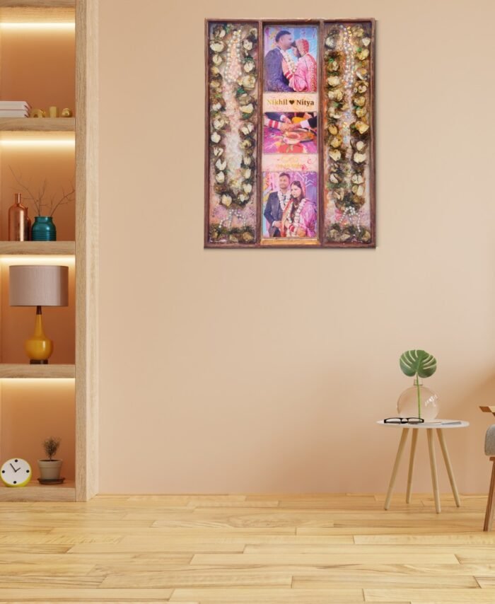 3-column full varmala preservation frame with preserved wedding garland flowers, couple photos, pearls, and decorative elements set in epoxy resin wooden wall frame.