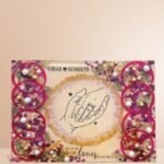 Customized floral preservation frame with preserved wedding flowers, pearls, and gold flakes in resin display