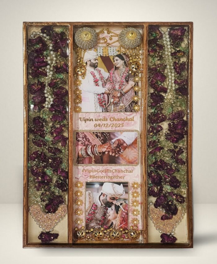 3 columns full varmala preservation frame with complete wedding garland preserved in epoxy resin, couple photos, pearls, and decorative elements in a wooden wall frame.