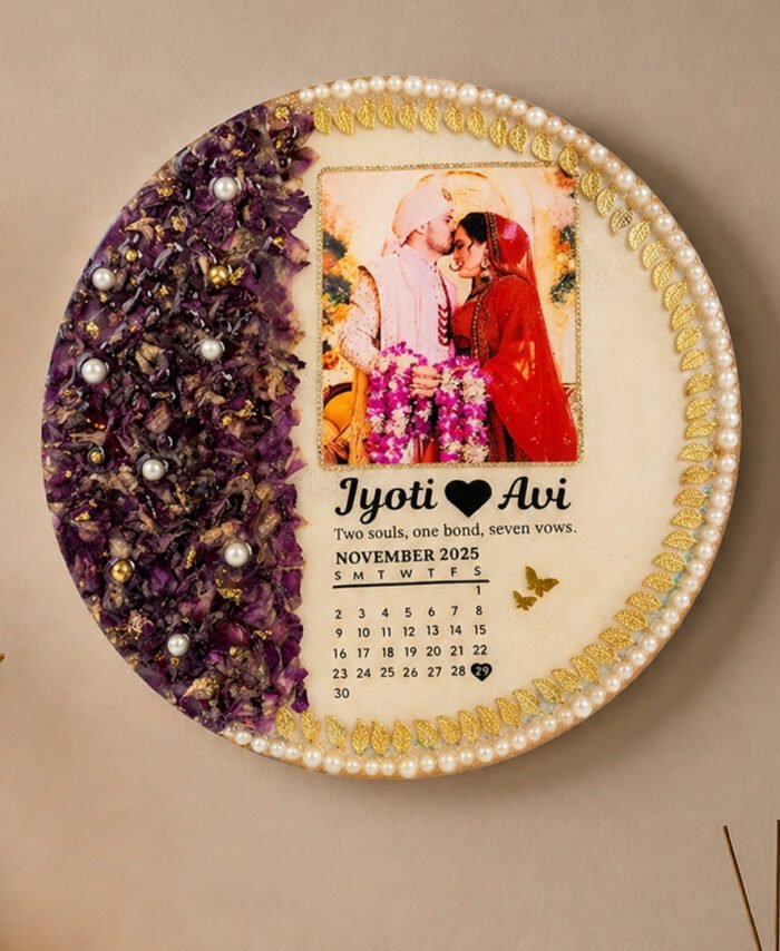 Round varmala resin frame with preserved wedding flowers, couple photo, calendar date, and pearl gold detailing