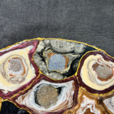 Handmade pebble table with smooth stone design and natural finish