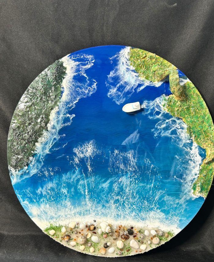 Round ocean resin wall art with blue waves, sandy beach texture, and glossy finish
