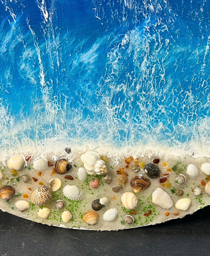 Round ocean resin wall art with blue waves, sandy beach texture, and glossy finish