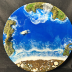 Round ocean wall art with blue resin waves, water fall and sandy beach design