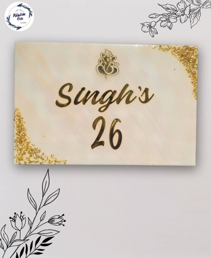 Elegant resin nameplate with family name and house number in gold finish on marble-style background