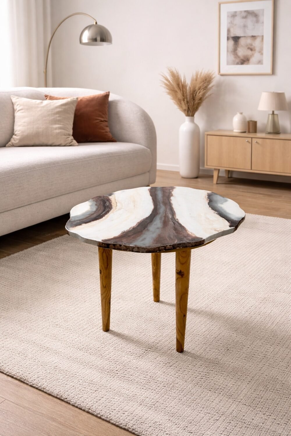 Agate marble coffee table with natural stone pattern top and wooden legs placed in a modern living room setting.
