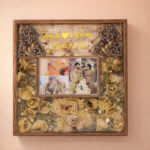 Customized wedding flower preservation frame with photos, golden dried flowers, names, and wedding date in resin