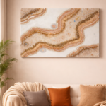 Beige and gold geode wall art with textured crystal design hanging above a sofa in a warm neutral living room