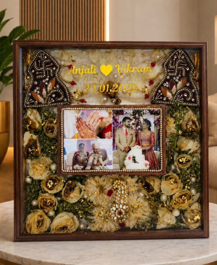 Customized wedding flower preservation frame with photos, golden dried flowers, names, and wedding date in resin