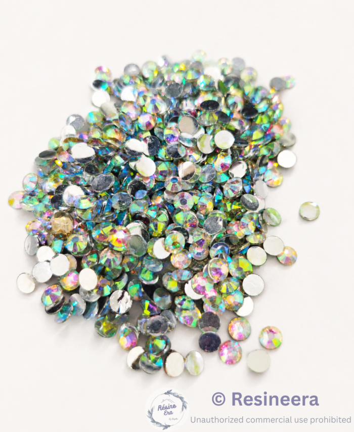 Colourful rainbow round beads for jewellery making and DIY craft projects on a white background.