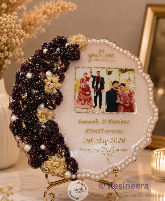 Handmade flower preservation frame with real dried flowers displayed inside an elegant memory frame.