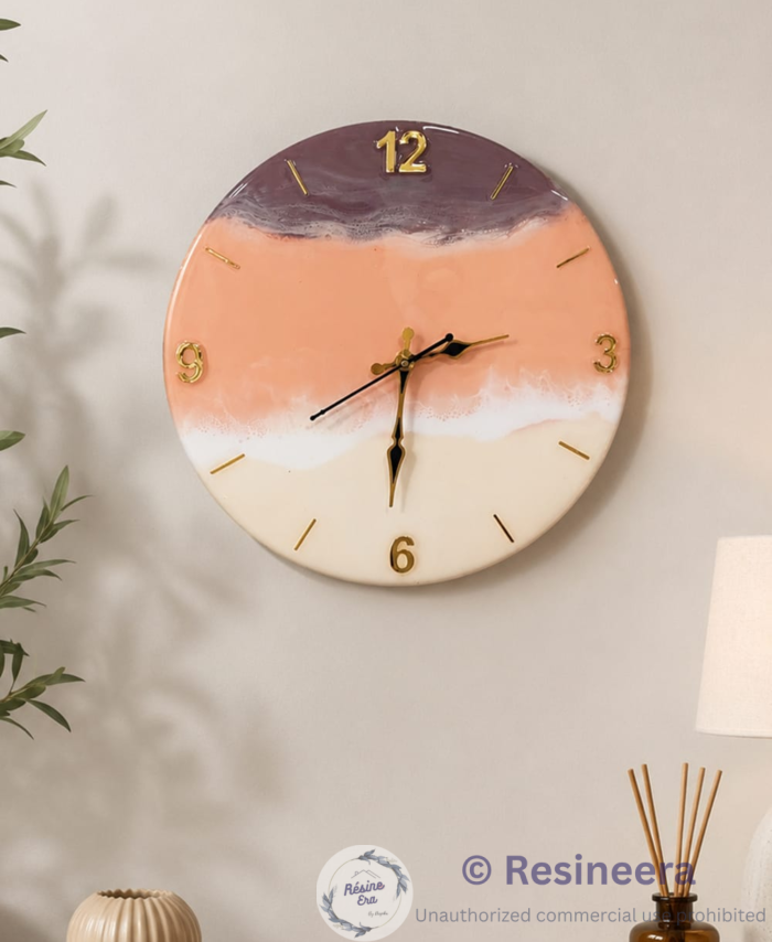 Handmade resin wall clock with peach, ivory, white, and lavender marble design featuring gold numbers and silent quartz movement.
