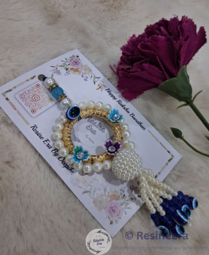 Blue pearl Rakhi with beaded tassels and peacock design