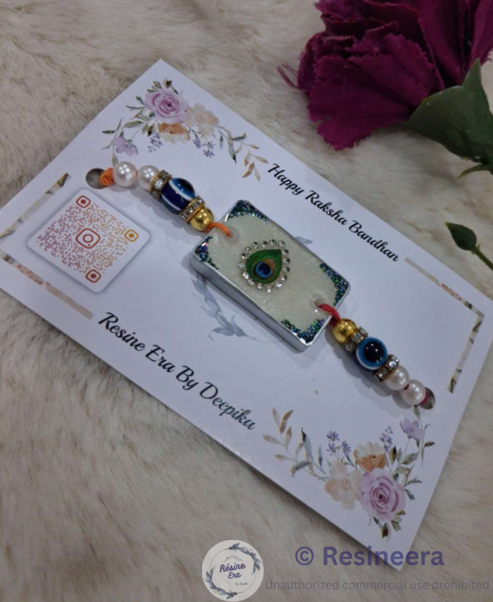 Green resin Rakhi with blue and gold bead detailing