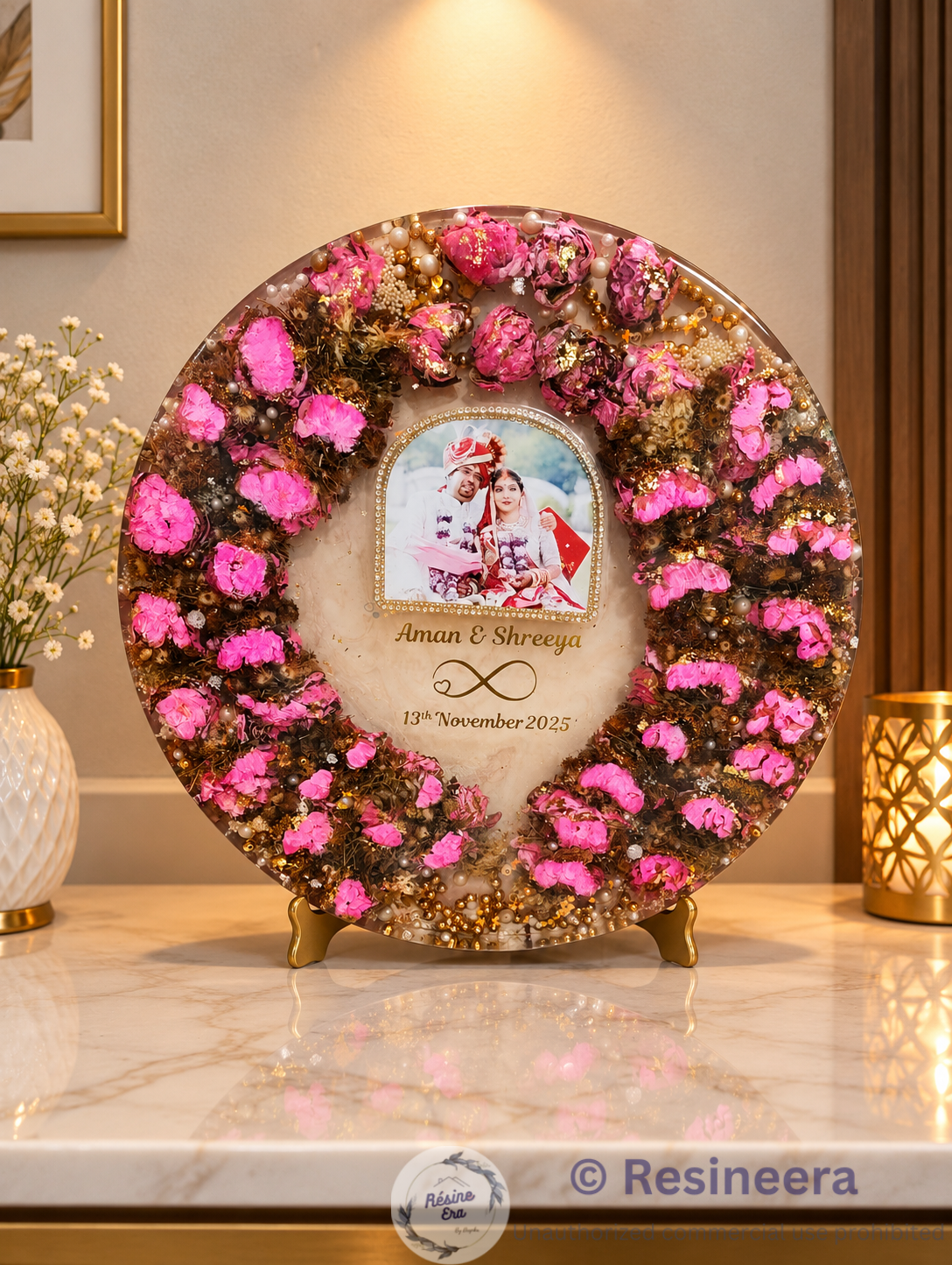 Lotus varmala Preservation Frame Round lotus and Varmala preservation frame with pink flowers, wedding photo, pearls, and golden decorative accents